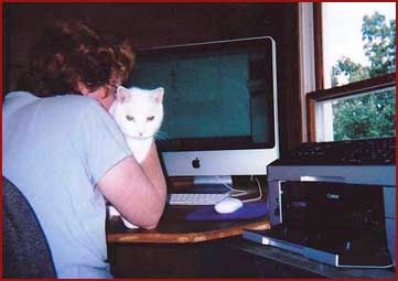 Yukon, white cat, helping Martha