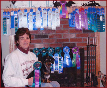 Proud owner Jenn with Bailey, showing off Super Bailey's ribbons!